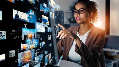 A women looks at data on a screen